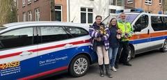 Wünschewagen mit drei Menschen und einem Hund