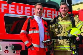 Plakat mit Feuerwehrmann und Rettungsdienstmitarbeiter