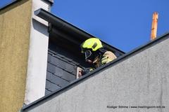 Feuerwehrmann auf Balkon